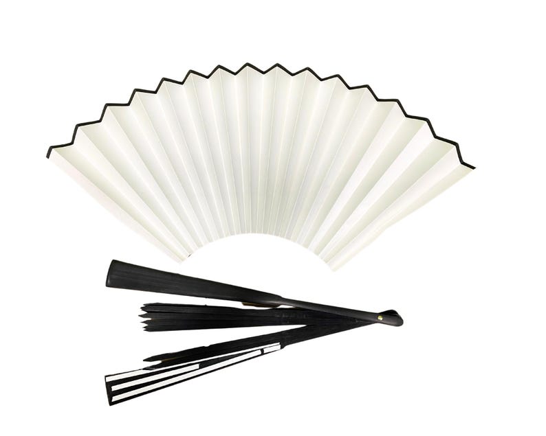 May include: A white folding fan with a black trim and a black folding fan handle.