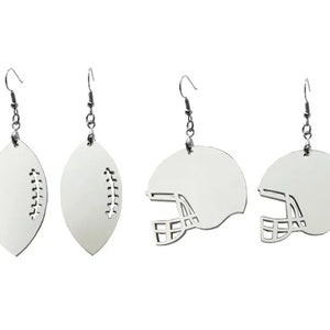 May include: A set of four silver earrings featuring two football and two football helmet designs. The earrings are made of metal and have a silver finish.