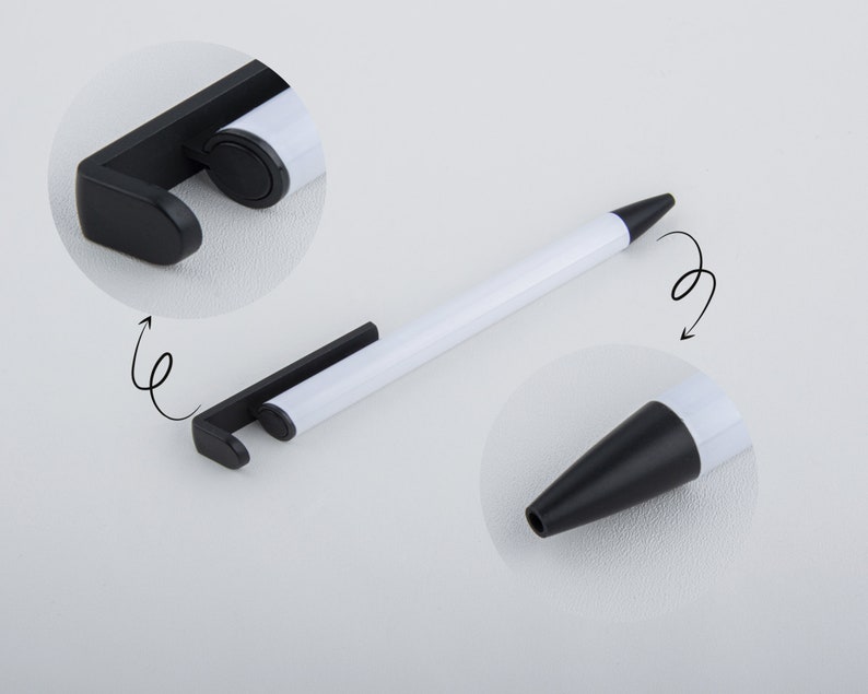 May include: A white pen with a black retractable tip and a black stand that can be used as a phone holder. The stand is attached to the pen and can be rotated.