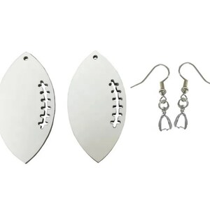 May include: A pair of white football-shaped earrings with a silver hook and jump ring. The earrings are blank and ready to be painted or decorated.