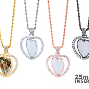 May include: Four silver heart-shaped photo locket necklaces with crystal accents. The lockets are available in gold, silver, rose gold, and black. Each locket has a 25mm insert for a photo. The text "25mm INSERTS" is printed below the lockets.