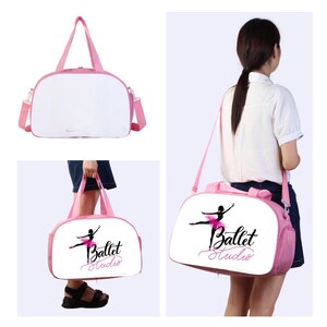 May include: Pink duffel bag with a white background and a black graphic of a ballerina with the text "Ballet Studio".