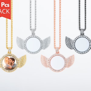 May include: A pack of 12 silver, gold, rose gold, and black necklaces with a round photo pendant and wings encrusted with rhinestones.  The pendants are blank and ready for a photo to be inserted.
