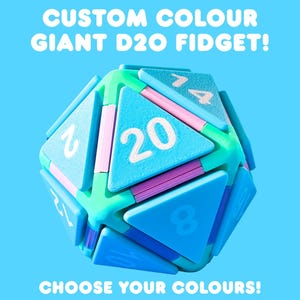 May include: A giant D20 fidget toy in shades of blue, green, and pink, with white numbers. The text "CUSTOM COLOUR GIANT D20 FIDGET!" and "CHOOSE YOUR COLOURS!" are displayed on a blue background.