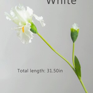 May include: White artificial iris flower with green stem and bud. Total length: 31.50in.