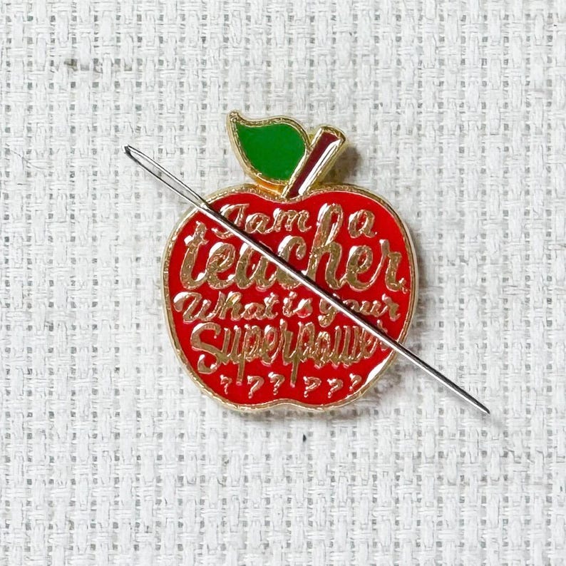 Red teacher apple magnetic enamel needle minder. Cute enamel accessory for cross stitch, embroidery, knitting, crocheting, sewing and needlepoint.