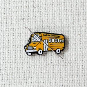 Yellow school bus magnetic enamel needle minder. Cute enamel accessory for cross stitch, embroidery, knitting, crocheting, sewing and needlepoint.