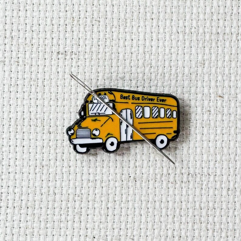 Yellow school bus magnetic enamel needle minder. Cute enamel accessory for cross stitch, embroidery, knitting, crocheting, sewing and needlepoint.