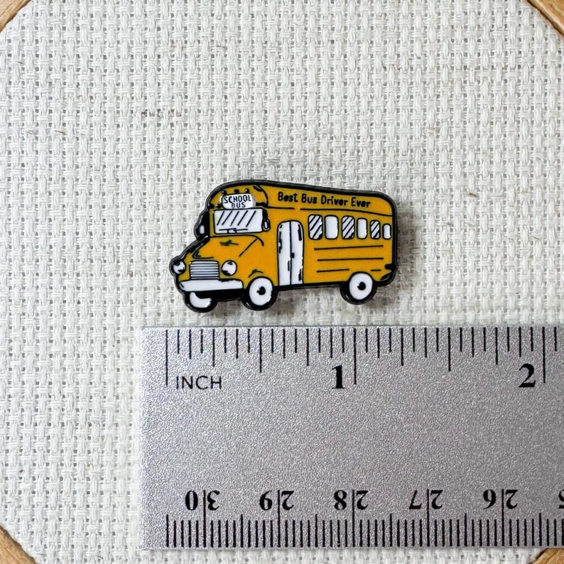 Yellow school bus magnetic enamel needle minder. Cute enamel accessory for cross stitch, embroidery, knitting, crocheting, sewing and needlepoint.