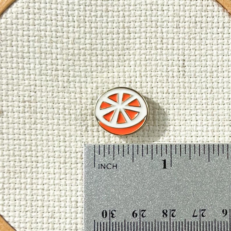 Magnetic orange enamel needle minder for cross stitch, embroidery, needlepoint and sewing – cute fruit needle holder, strong needle magnet.