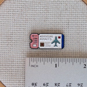 Airplane ticket magnetic needle minder – travel themed enamel accessory for cross stitch, embroidery, and needlepoint – fun stitching gift for travelers and adventure lovers.