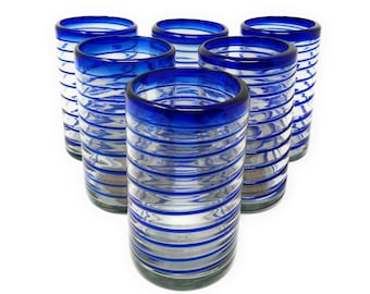 May include: Set of six blue and clear glass drinking glasses with a striped design. The glasses are stacked in a triangular shape.