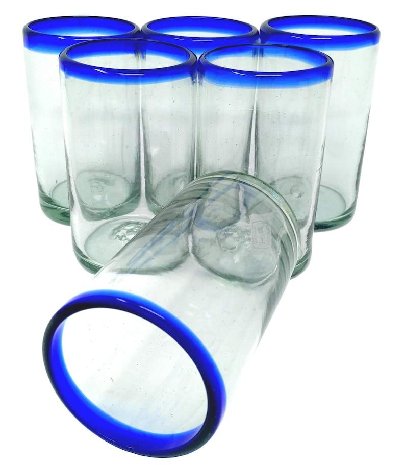 May include: Set of six clear glass tumblers with a blue rim. The glasses are stacked and angled, showcasing the blue rim.