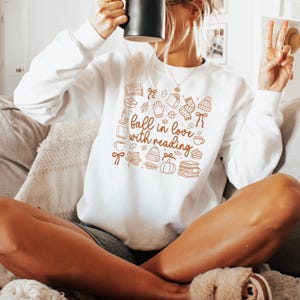 Bookish Fall in Love Fall Sweatshirt Fall Sweatshirts Bookish Sweatshirt Spooky Season Shirt Booktokers Crewneck Fall Sweater Cozy Readers