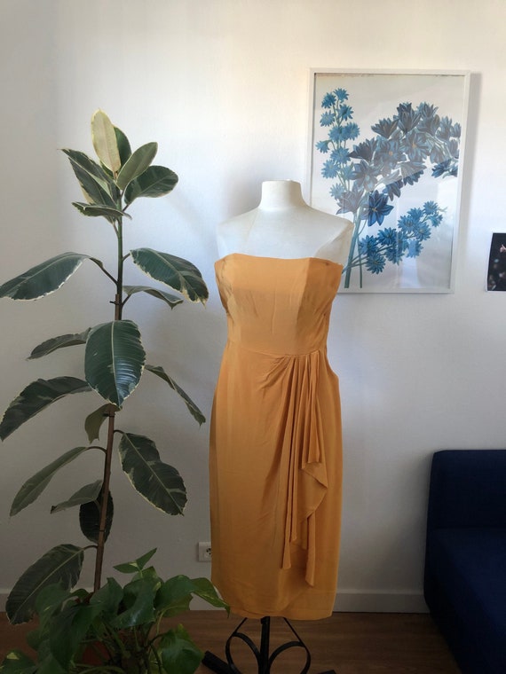 Yellow cocktail peplum dress
