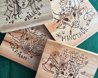 Drink coasters, hand woodburned coasters, monster characters, reader, sci-fi, romance reader, monster romance, fantasy romance, book merch