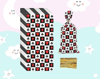 May include: A stack of black and white party favor bags with a red and black checkered pattern and playing card symbols. The bags are made of plastic and have a twist tie closure. The bags are accompanied by a bundle of gold twist ties.