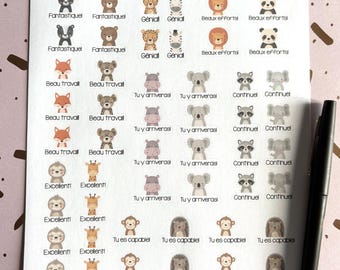 May include: A sheet of adhesive stickers featuring various illustrated animals including bears, lions, pandas, and koalas, each paired with French motivational phrases like Fantastique, Génial, and Tu y arriveras, alongside a black pen on the side.