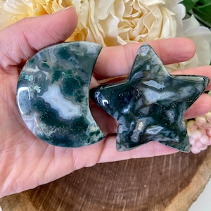 May include: Green and white agate stone carved into a crescent moon and a five-pointed star shape.