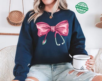 Coquette Nurse Stethoscope Bow Sweatshirt, Gift for Nurse, Bow Oversized Hoodie, Nurse Appreciation, Christmas Gift for Nurse, Pink Bow