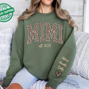 Custom Leopard Mimi Sweatshirt With Kid Name On Sleeve, Personalized Mimi Sweatshirt, Gift For Mimi, Christmas Gift Mimi Est 2026 Hoodie
