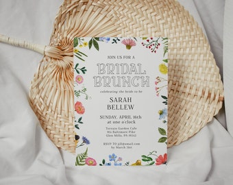 May include: A white invitation for a bridal brunch, adorned with a floral border of colorful watercolor flowers. The text reads "Join us for a Bridal Brunch" and includes event details and RSVP information.