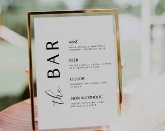 May include: A gold-framed sign with the text "the BAR" in cursive script. The sign lists various alcoholic and non-alcoholic beverages available, including wine, beer, liquor, water, lemonade, and coke products.