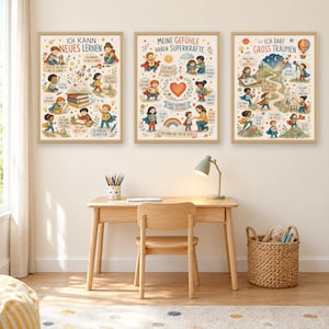 May include: Three framed educational posters with light wood frames, each featuring colorful illustrations of children in superhero capes and German text. The posters depict themes of learning, emotional intelligence, and dreaming.