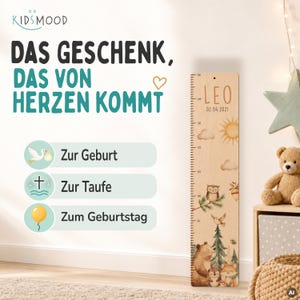 May include: A wooden height chart featuring a printed scale from 90 to 150 cm, personalized with the name LEO and the date 02.04.2021. The design includes illustrations of a sun, clouds, an owl, a bear, a hedgehog, and a fox.