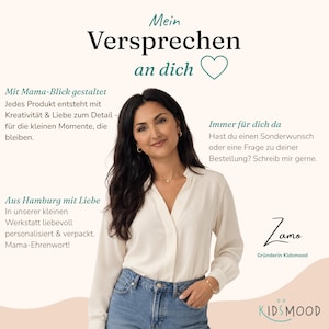 May include: A woman with long dark hair wearing a cream-colored long-sleeved blouse and blue jeans. The image includes text in German: Mein Versprechen an dich, Mit Mama-Blick gestaltet, Immer f&uuml;r dich da, Aus Hamburg mit Liebe, Zamo, and Kidsmood.