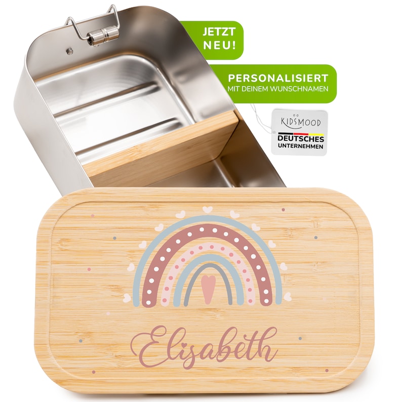 Może przedstawiać: Spersonalizowana lunchbox ze stali nierdzewnej z bambusową pokrywką. Pokrywka przedstawia tęczę w kolorze r&oacute;żowym, niebieskim i brązowym oraz imię "Elizabeth" w r&oacute;żowych literach. Lunchbox jest idealna dla dzieci i ma zdejmowany separator.
