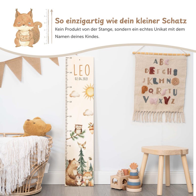 May include: A wooden height chart featuring a printed forest theme with a bear, owl, fox, hedgehog, sun, and clouds. The chart displays the name LEO and the date 02.04.2021, with measurement markings ranging from 70 to 150 centimeters.