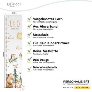 May include: A rectangular growth chart measuring 20 cm by 90 cm, featuring a pre-drilled hole, a measurement scale from 65 cm to 150 cm, and illustrations of a bear, fox, owl, sun, and clouds, with the name LEO and date 02.04.2021.