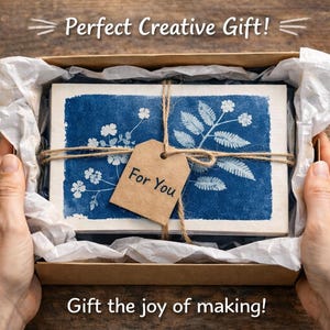 May include: A gift box with a blue floral design, tied with twine and a tag that says "For You". The box is lined with white paper and the text "Perfect Creative Gift!" and "Gift the joy of making!" are visible.