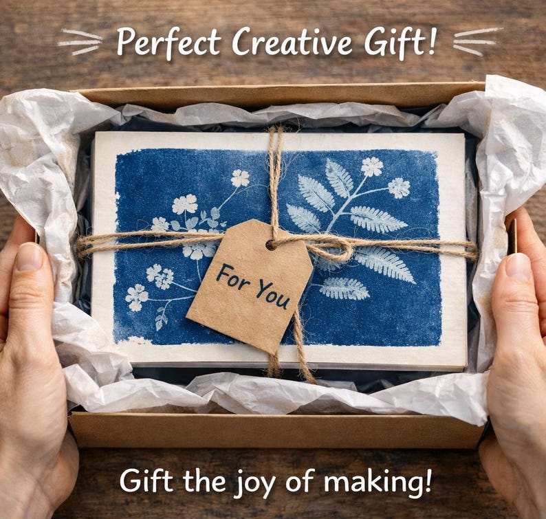 May include: A gift box with a blue floral design, tied with twine and a tag that says "For You". The box is lined with white paper and the text "Perfect Creative Gift!" and "Gift the joy of making!" are visible.