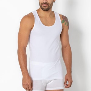 May include: A white sleeveless undershirt with a scoop neck.