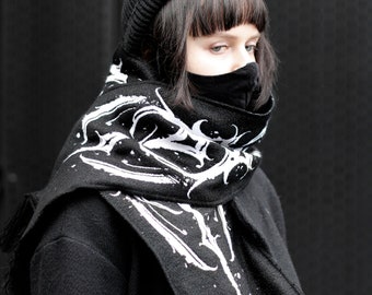 Black scarf with white ornament