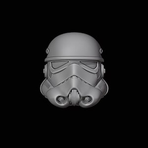 May include: A grey plastic model of a Star Wars Stormtrooper helmet.