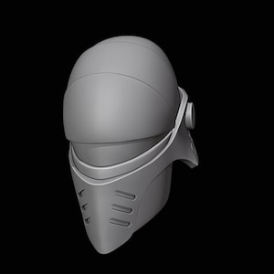 May include: A grey helmet with a visor and a textured surface. The helmet has a small detail on the side.