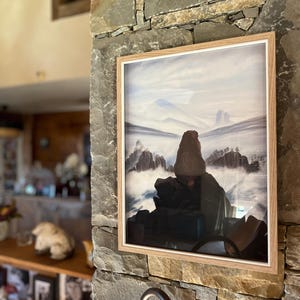 Marmot contemplant une mer de nuages