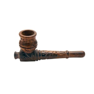 May include: A carved wooden pipe with a bowl and stem. The pipe is made of dark brown wood and features intricate carvings along the stem and bowl. The bowl is cylindrical with a rounded top. The stem is long and slender.