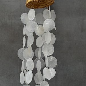 Mobile with white mother-of-pearl discs