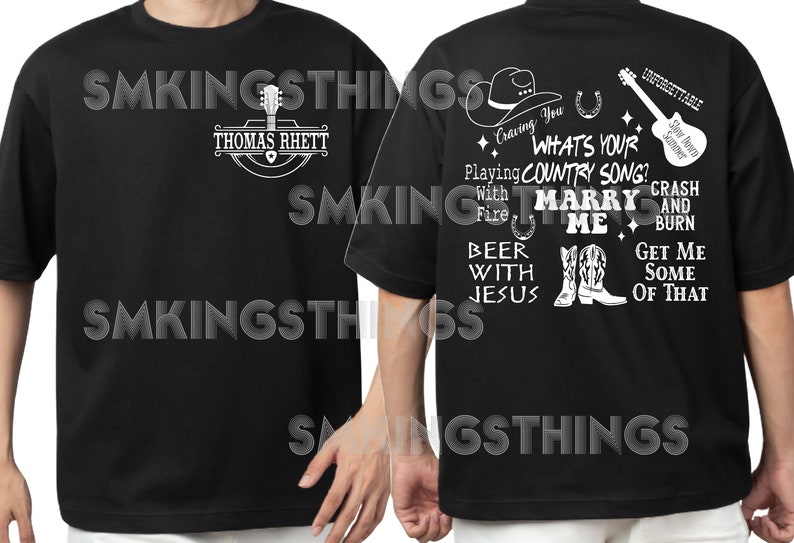 May include: Black t-shirt with a white graphic design featuring a cowboy hat, horseshoe, guitar, boots, and text that reads "Craving You, What's Your Country Song? Playing With Fire, Marry Me, Beer With Jesus, Crash And Burn, Get Me Some Of That".