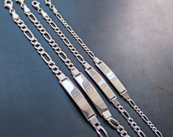 May include: Four silver chain bracelets with rectangular nameplate charms. The chains are of varying lengths and widths.