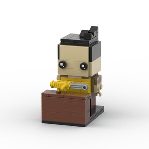 May include: A Lego minifigure of a character holding a chainsaw. The minifigure is wearing a yellow shirt and has black hair. The minifigure is standing on a small brown platform.