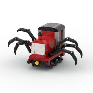 Puede incluir: Un tren de juguete rojo y negro con patas de araña. El tren tiene una cara blanca con ojos negros y una luz amarilla en la parte delantera.