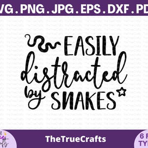 May include: Black and white text graphic design that reads "I'm easily distracted by snakes" with a small star next to the word "snakes".