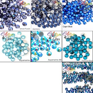 May include: A collection of round, faceted flat-back rhinestones in various blue and purple shades, labeled as Ghost Purple, Montana, Capri Blue, Aquamarine, Aquamarine AB, Peacock Blue, and Peacock Blue AB, each featuring the Glitzer 4 You logo.