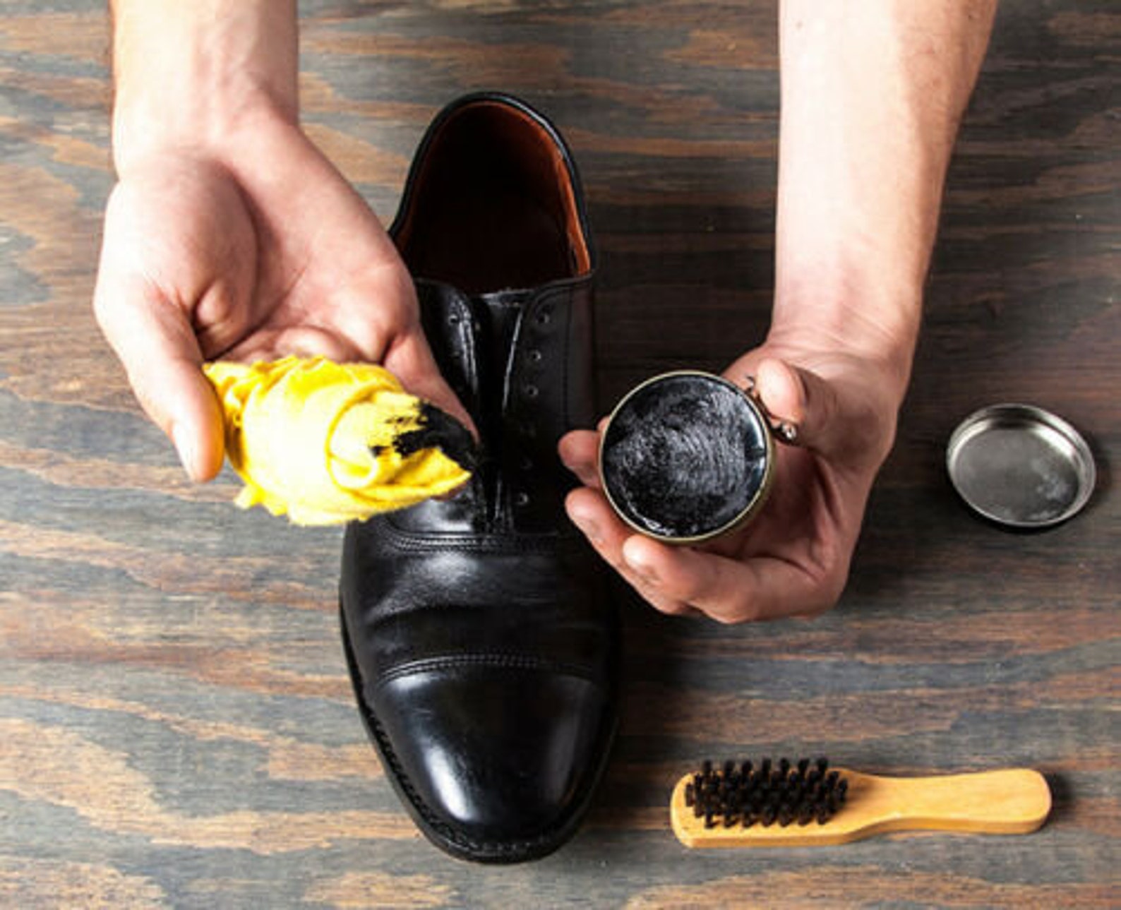 polishing boots with kiwi