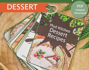 May include: A set of printable mud kitchen dessert recipes, featuring a close-up of a mud pie with berries and a green leaf. The recipes are available as a PDF instant download. The text on the cards reads "Mud Kitchen Dessert Recipes".